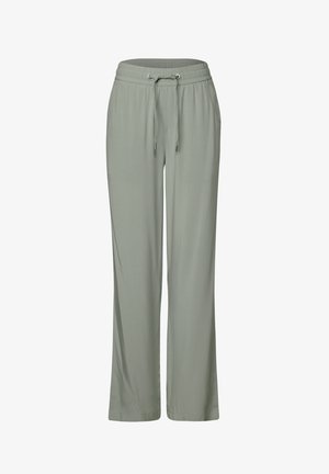 Jasnozielone, luźne spodnie wykonane z miękkiego materiału, z elastycznym pasem w talii i sznureczkiem oraz szerokimi nogawkami.