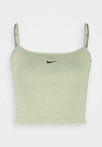 Ljusgrön ribbad crop top med justerbara band och en svart Nike-logga på framsidan. Har en figurnära design och mjuk textur.