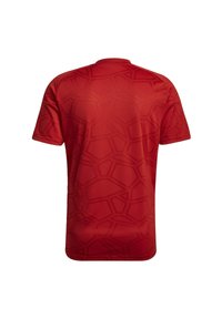 Jersey rosso a maniche corte con un motivo geometrico testurizzato e scollatura rotonda. Materiale liscio con una forma leggermente aderente.