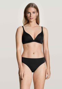 Black lingerie set featuring a seamless, triangular bra and matching briefs. The fabric has a smooth texture and adjustable straps.