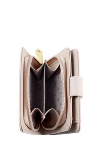 Pink leather wallet with multiple compartments, a zippered section, and a smooth texture. Features a gold pull tab and polka-dotted lining.