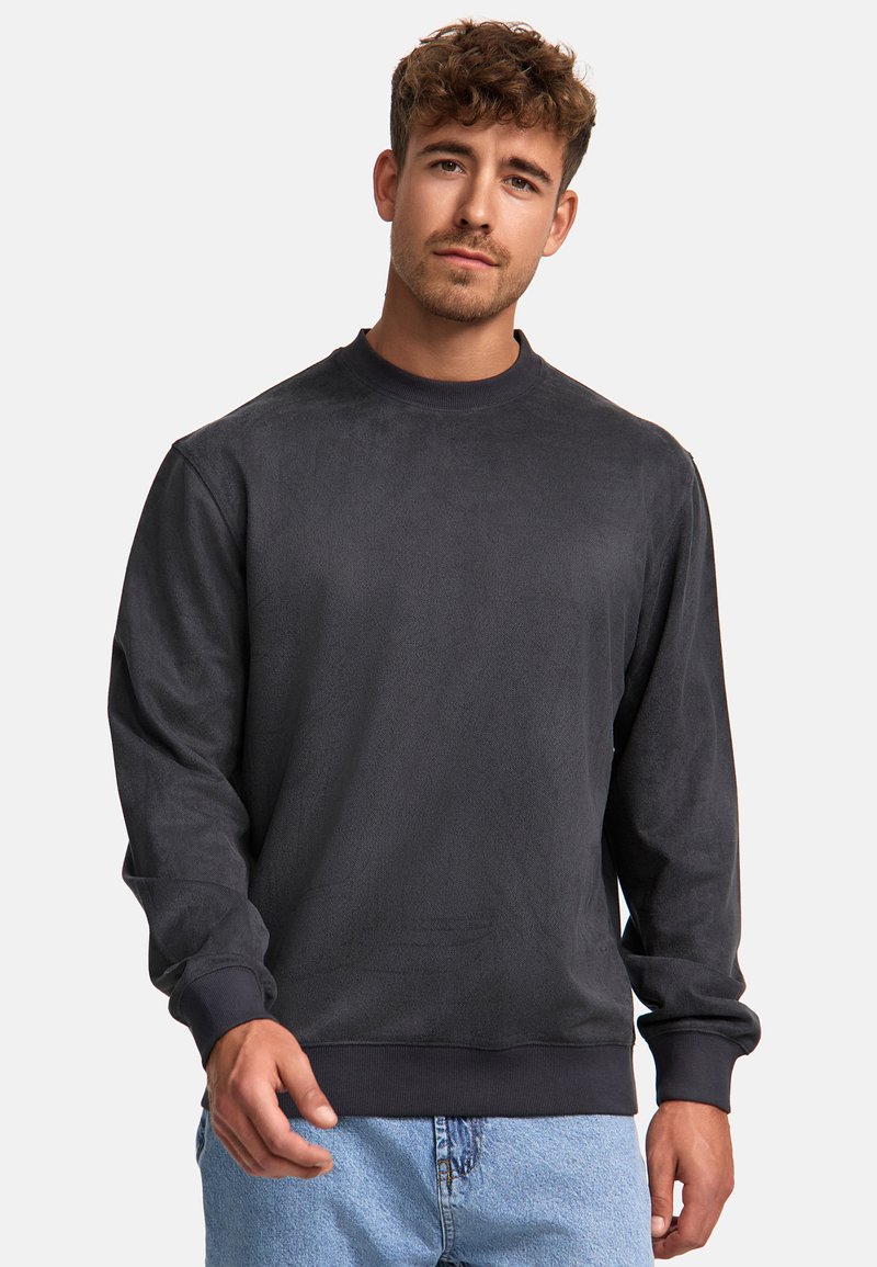 Mørkegrå langærmet sweatshirt i et blødt stof, med rund hals, ribbede mansjetter og talje. Enkel, minimal design uden mønstre.