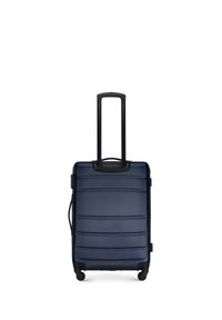 Valigia di dimensioni cabine di colore blu navy con guscio rigido testurizzato, scanalature verticali, manico retrattile e quattro ruote nere per la mobilità.