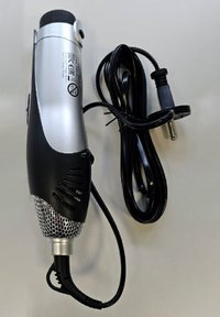 Handheld silver and black hair dryer with ventilation grills and coiled black electric cord with plug on white background.