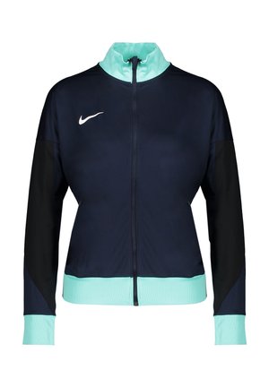 Veste de sport bleu marine zippée avec manches noires, col, poignets et ourlet bleu clair, avec un logo Nike blanc sur la poitrine.