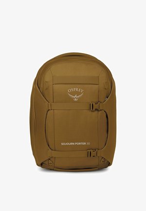 Zaino Osprey Sojourn Porter 30 marrone con superficie testurizzata, chiusura anteriore con fibbia e logo, dotato di design ergonomico e ampio spazio di stoccaggio.