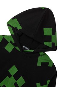 Felpa nera con un distintivo motivo verde pixelato, realizzata in tessuto morbido, con una tasca a marsupio frontale e un ampio cappuccio.