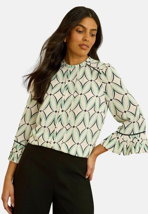 Floral patterned blouse with green, black, and cream tones. Features a high neckline and ruffle sleeves. Made from lightweight fabric.