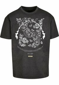 Black t-shirt featuring a detailed white floral and paisley print. Includes "M. Gonzalez Design Department" and "EST. 2015" text elements.