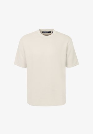Effen beige T-shirt met korte mouwen en ronde hals met een klein reliëflogo nabij de onderzoom, afgebeeld op een witte achtergrond.