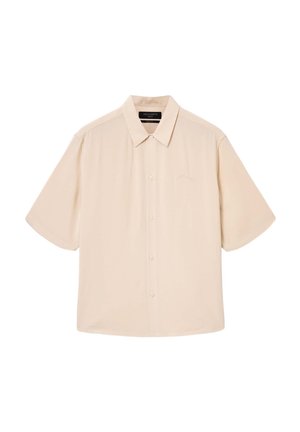 Beige lyhythihainen napillinen paita, jossa on klassinen kaulus, sileä pinta, hillitty logopistely ja rento istuvuus.