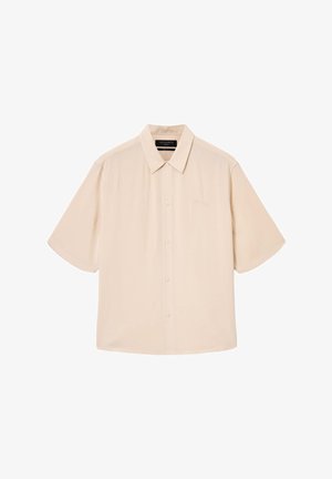 Beige short-sleeve button-up shirt with a classic collar, smooth texture, subtle logo embroidery, and a relaxed fit.