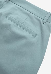 Next SLIM FIT STRETCH - Chino hlače - light blue