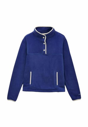 Mėlynas vilnonis megztinis su aukštu apykakle, trimis baltais mygtukais, dviem priekinėmis kišenėmis ir baltais apvadas ant apykaklės, kišenių bei rankogalių.