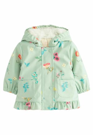 Vaaleanvihreä kukkakuosisateenpusero, jossa on pehmeä valkoinen fleece-vuori, nepparit, kaksi etutaskua ja röyhelöhelma.