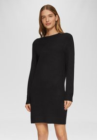 Schwarzes Strickkleid mit langen Ärmeln und Rundhalsausschnitt, gerader Schnitt und gerippte Bündchen, glatte Textur und minimalistisches Design.