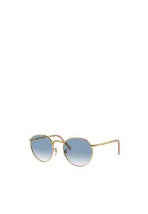 Occhiali da sole in metallo dorato con montatura ovale e lenti grigio sfumate. Presentano tempie sottili con un accento rosa chiaro.