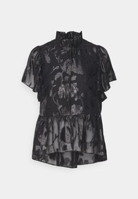 Blouse noire transparente avec col montant à volants, manches courtes bouffantes, motif floral et ourlet à volants superposés.