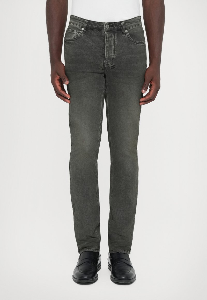 Dark grey denim jeans with a slim fit, five-pocket design, and a button closure. Textured fabric with subtle fading and stitching details.