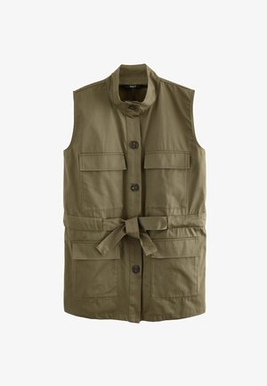 Olivengrøn ærmeløs vest lavet af bomuld med højt krave, frontlukning med knapper, to påsynkede lommer og en bælte i taljen.