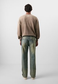 Don't Waste Culture ZIGA UNISEX - Calças de ganga folgadas - ocean sand