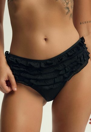 Czarny dół bikini z warstwowymi falbankami, o miękkiej fakturze i regulowanymi z boku sznurków. Zaprojektowany w celu idealnego dopasowania.