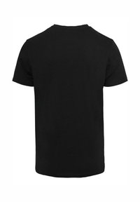 Camiseta de algodón negra de manga corta con cuello redondo, presenta un diseño básico y una textura suave, vista desde la parte posterior.