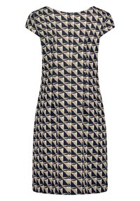Robe courte à manches courtes, longueur genou, avec motif géométrique de triangles beige, noir et bleu marine et fermeture éclair au dos sur fond blanc.