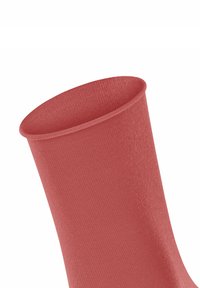 Rote, gerippte Socke mit glatter, solider Textur und weitem Opening. Das Material scheint dehnbar und formschlüssig zu sein.