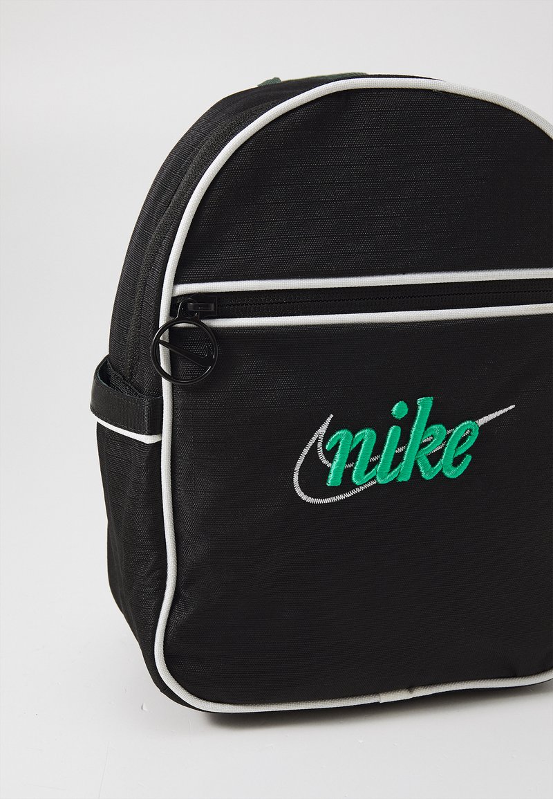 nike backpack small logo while a zippered front pocket keeps smaller items within easy reach Nike JDI Backpack Kids' Mini