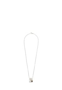 Silver necklace with a textured rectangular pendant, featuring a small round amber stone. Thin chain evenly supports the pendant.