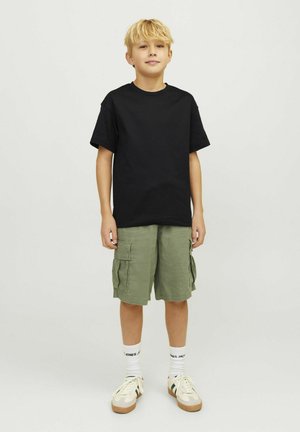 Black cotton t-shirt, green cargo shorts with side pockets, white crew socks, and beige sneakers with tan accents. Simple, casual outfit.