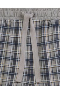Szorty w kratę w odcieniach beżu i granatu z żółtymi akcentami. Elastyczny pas z wiązanym sznurkiem. Miękka bawełniana tkanina.