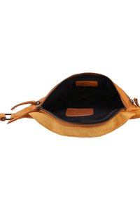 Tan leather bag with a zip closure, showing a dark fabric interior. Features suede texture on the exterior and a small leather tag inside.