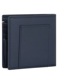 Navy leather wallet with a slim design, featuring stitching details, card slots, and a rear pocket for additional storage.