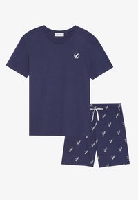 Mörkblå bomullsoverall som inkluderar en t-skjorta med kort ärm och en liten logotyp samt mönstrade shorts med ett kontrasterande vitt snöre och detaljer.