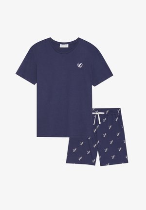 Navy blue cotton pajama set featuring a short-sleeve t-shirt with a small logo and patterned shorts with contrasting white drawstring and accents.