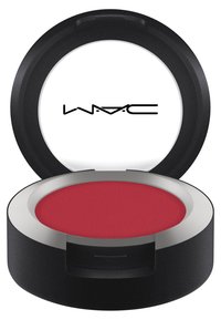 Compact de fard à joues rouge avec une surface texturée, enfermé dans un boîtier rond noir mat, avec une bordure en argent métallique et un couvercle transparent.