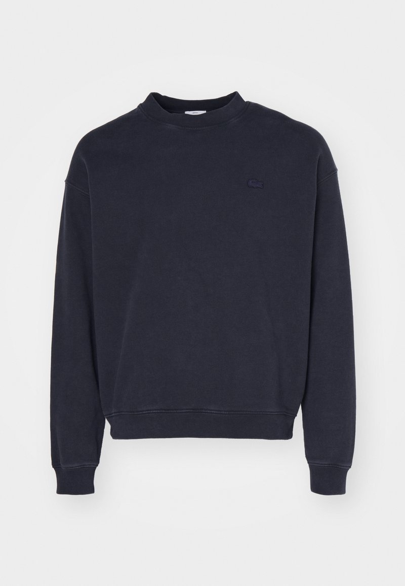 Námořnická crewneck mikina vyrobená z bavlněné směsi, s žebrovaným výstřihem a manžetami, s malým vyšitým logem na levé straně hrudi.