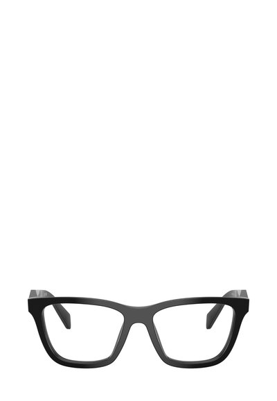 Occhiali rettangolari neri con montature spesse e angoli netti. Lenti trasparenti e aste piatte sottolineano un design geometrico moderno.