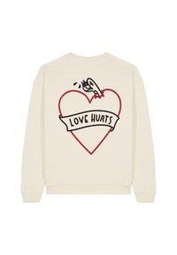 Felpa color crema con una grafica di un cuore contornato di rosso e il testo nero "LOVE HURTS", con un design cartoonesco sul retro.