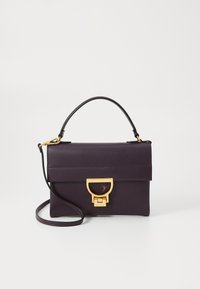 Purple leather handbag with a top handle and detachable shoulder strap. Features a gold-tone clasp and textured surface with a flat design.