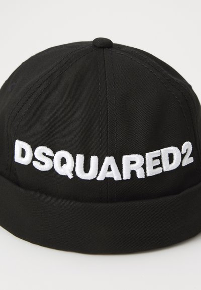 Black cap made of fabric featuring a white embroidered logo "DSQUARED2" across the front, with a rounded crown and soft brim.