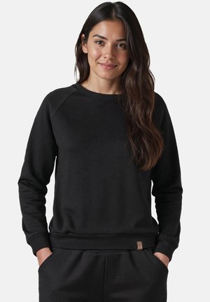 Zwarte sweatshirt gemaakt van zacht materiaal, met een geribbelde halslijn en manchetten, voorzien van een klein merklabel aan de onderrand. Casual pasvorm.