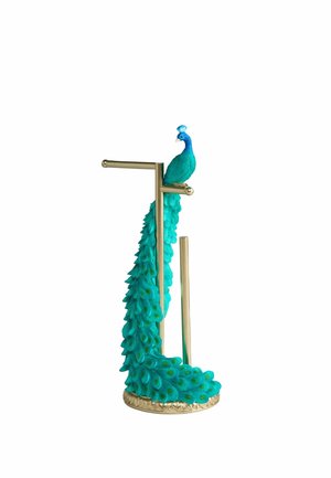 Decorative teal peacock sculpture with long detailed tail perched on a gold-colored metal stand with horizontal and vertical bars.