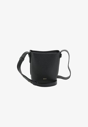 Black leather bucket bag with a textured surface, short strap, and gold logo detail at the base. Circular shape with an open top.