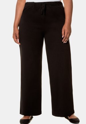 Schwarze, weit geschnittene Hosen aus weichem Material, mit einem elastischen Bund und einer Kordel. Glatte Textur und lässiges Design.