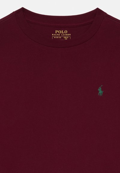 Bordo kokvilnas t-krekls ar apaļu kakla izgriezumu un īsām piedurknēm. Uz kreisās krūts ir maza zaļa polo logo.