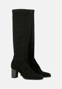 Bottes en daim noires montantes avec un talon bloc, présentant une texture lisse, un bout arrondi et un design minimaliste pour une apparence élégante.