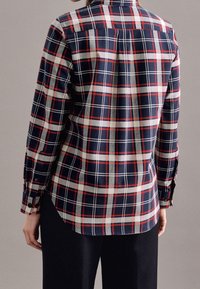 Navy blue and red plaid shirt with long sleeves, buttoned cuffs, and a classic collar. Lightweight fabric with a smooth texture.